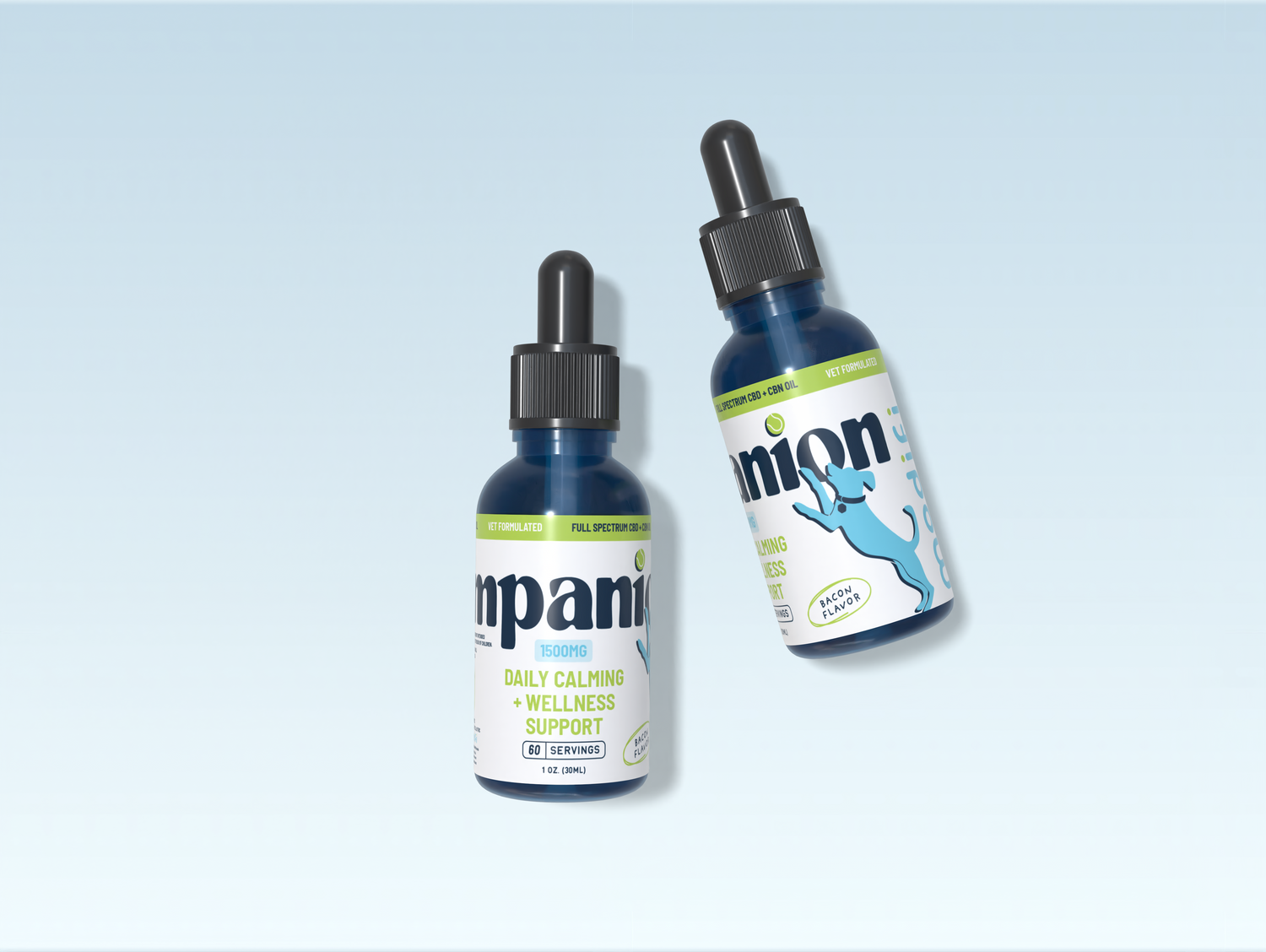 2 tincture bottles laying on a light blue background