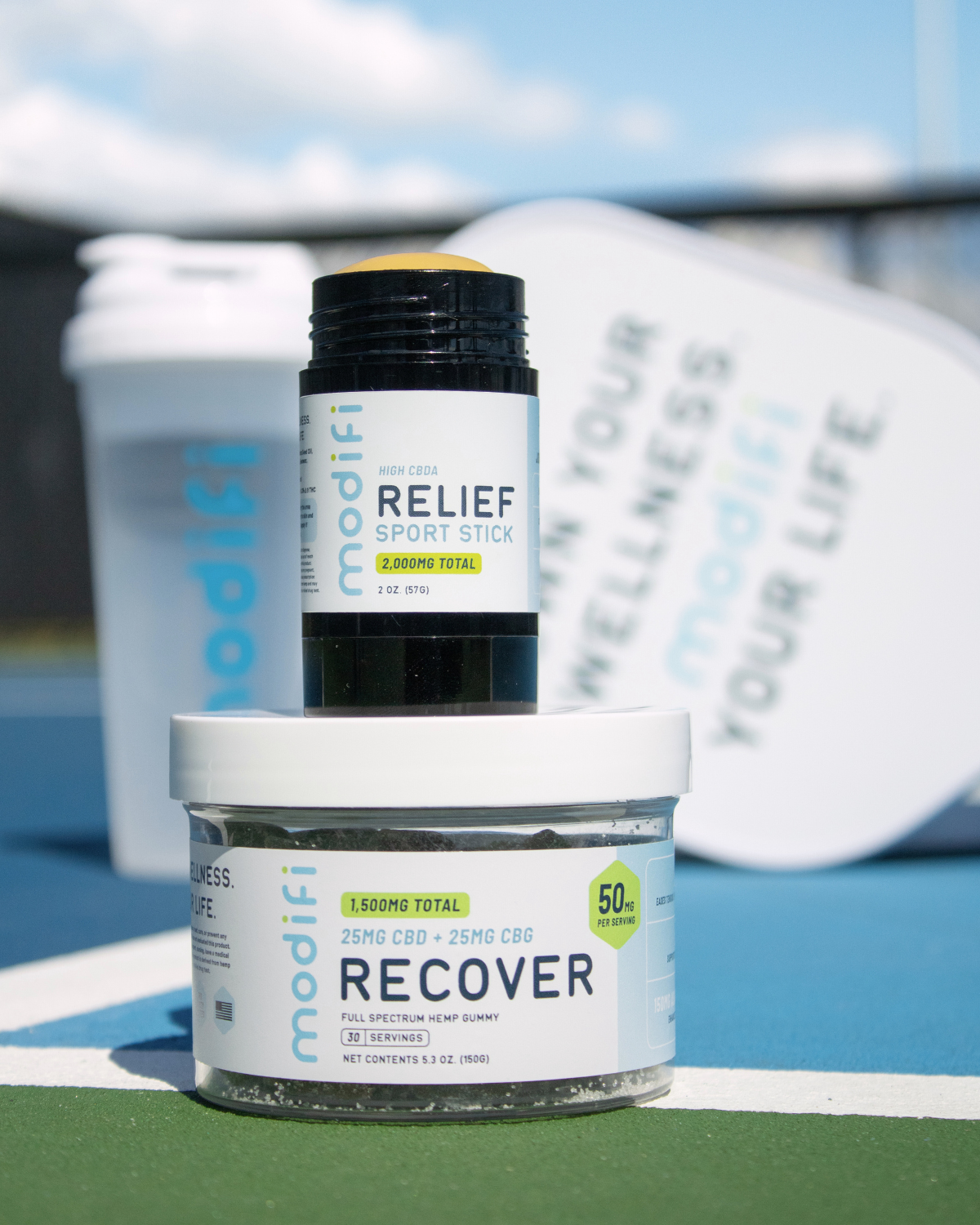 relief sport stick and recover gummy on tennis court