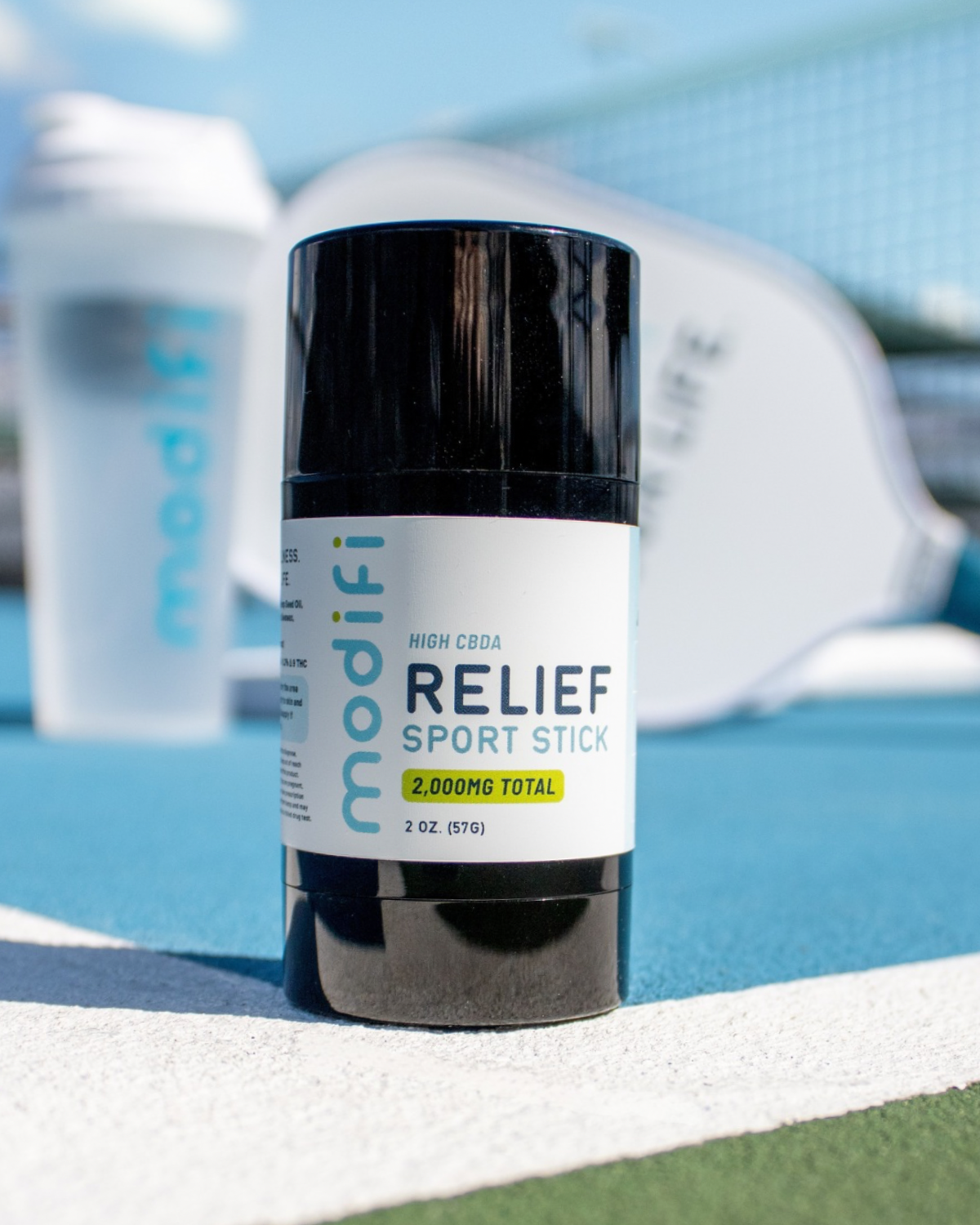 Relief Sport Stick by modiif on a blue surface with blurred background
